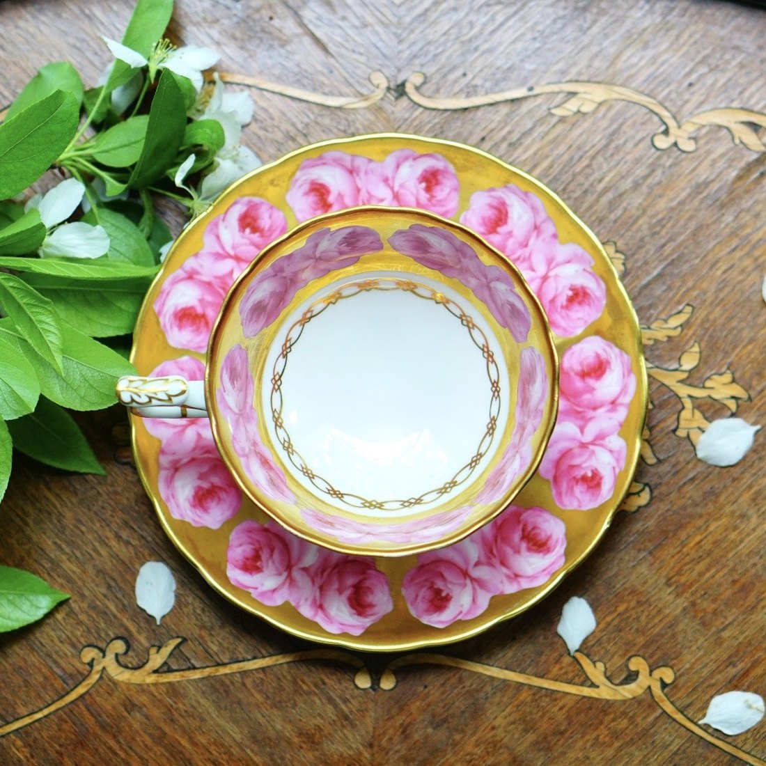 Royal Chelsea bone china teacup and saucer, pink cabbage roses on a heavy gold ground, pattern 4947A, England 1950s