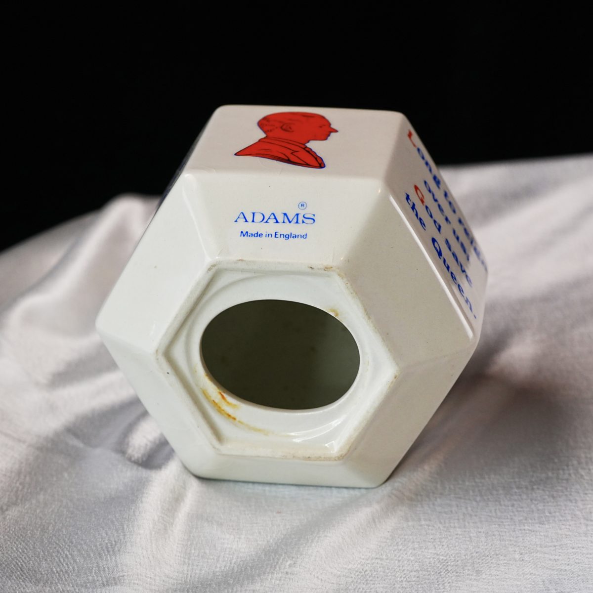 Maker's mark on the base of Vintage Adams QEII Silver Jubilee Money Box 1977