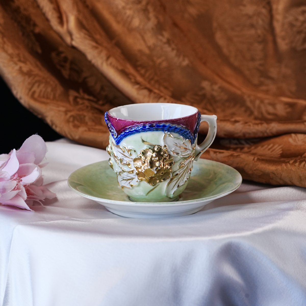 Antique Victorian "A Present" Souvenir Cup and Saucer – Green Lustre Glaze, Gold Relief Fruit, Beaded Rim, Porcelain, Germany 1890s